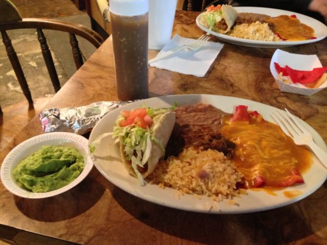 The Mexican plate: two cheese enchiladas, carne guisada, puffy taco, rice and beans.
